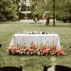 Sweetheart table at a wedding reception by Seedling and Sage Catering