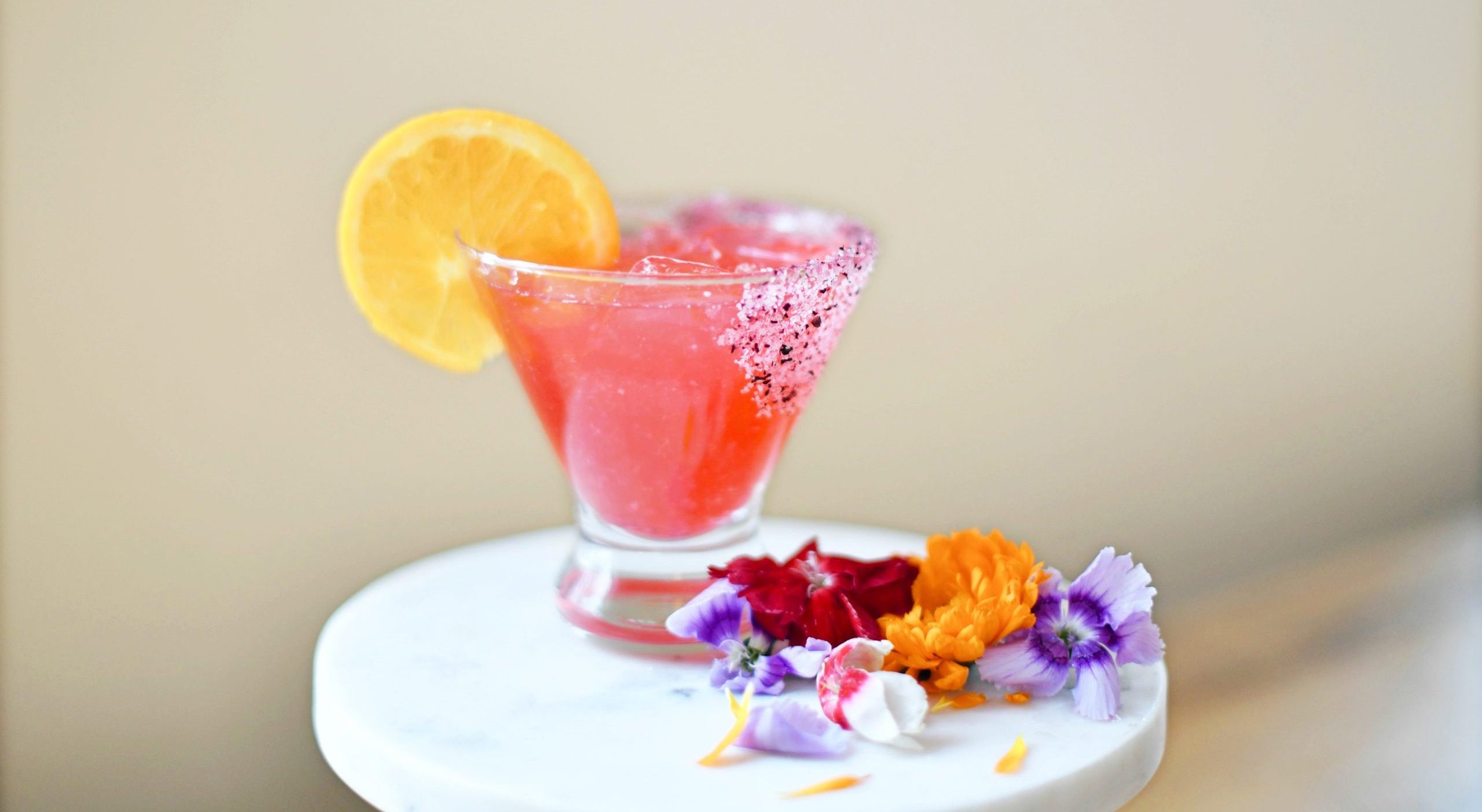 Vibrant pink cocktail by Seedling and Sage Catering