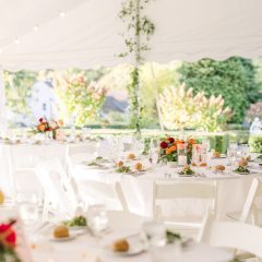 Wedding reception tables under white tent in Philadelphia suburb