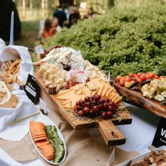 Extravagant cheese and charcuterie display at a wedding by Seedling and Sage Catering