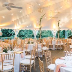 Wedding reception tables under white tent in Philadelphia suburb