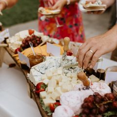 Extravagant cheese and charcuterie display at a wedding by Seedling and Sage Catering