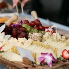 Extravagant cheese and charcuterie display at a wedding by Seedling and Sage Catering