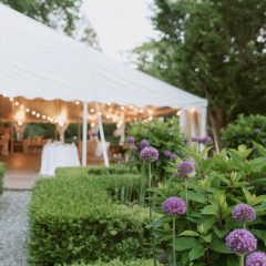 Wedding reception tables under white tent in Philadelphia suburb