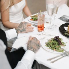 Bride and groom at dining table of wedding reception in Philadelphia, PA