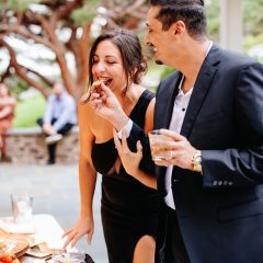 Couple enjoying wedding appetizers at cocktail hour in Philadelphia, PA