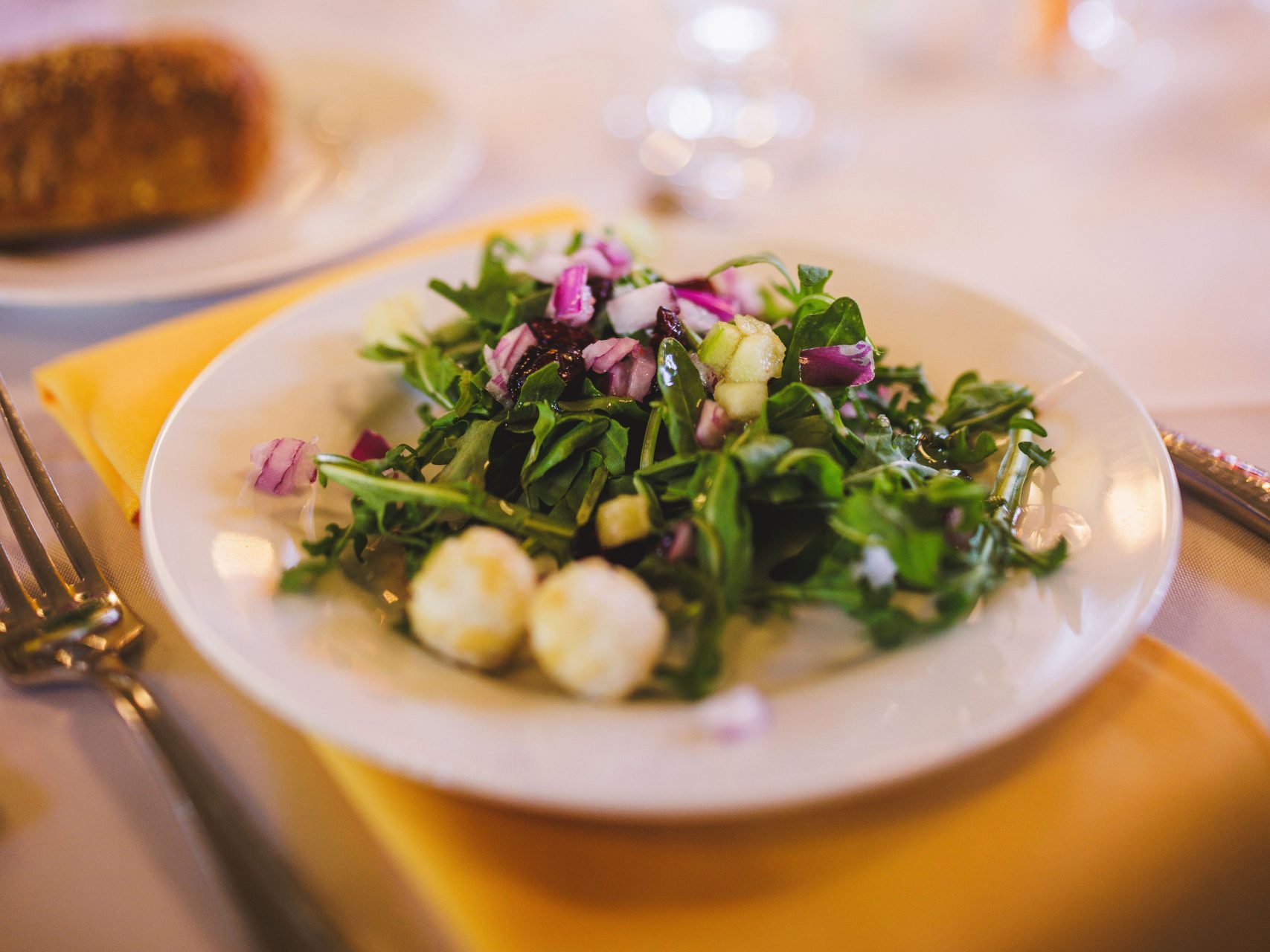 Elegant salad course at a wedding reception by Seedling and Sage Catering