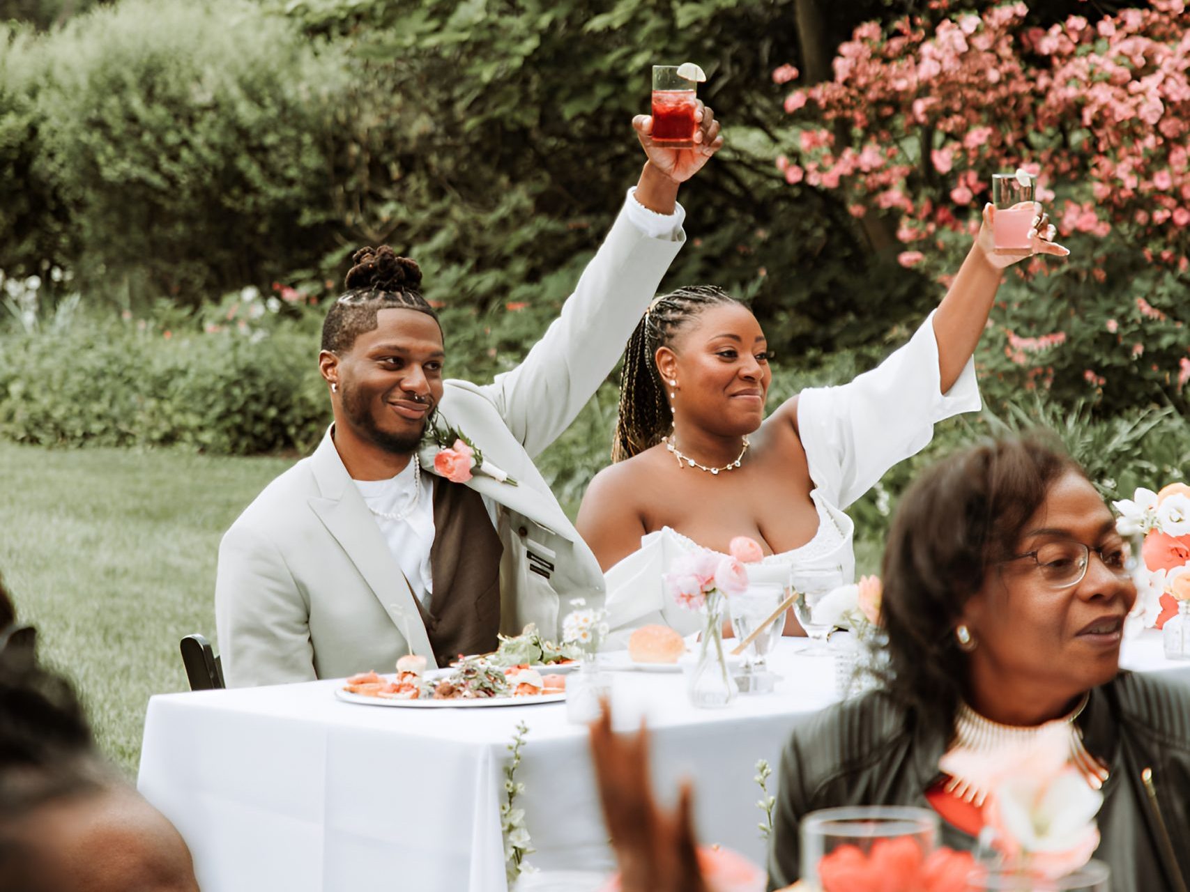 Beautiful newlyweds raising a glass to toast their love in Philadelphia PA