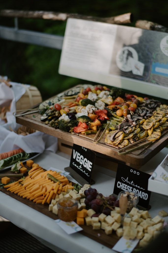 Cheese and charcuterie table at wedding reception by Seedling and Sage Catering