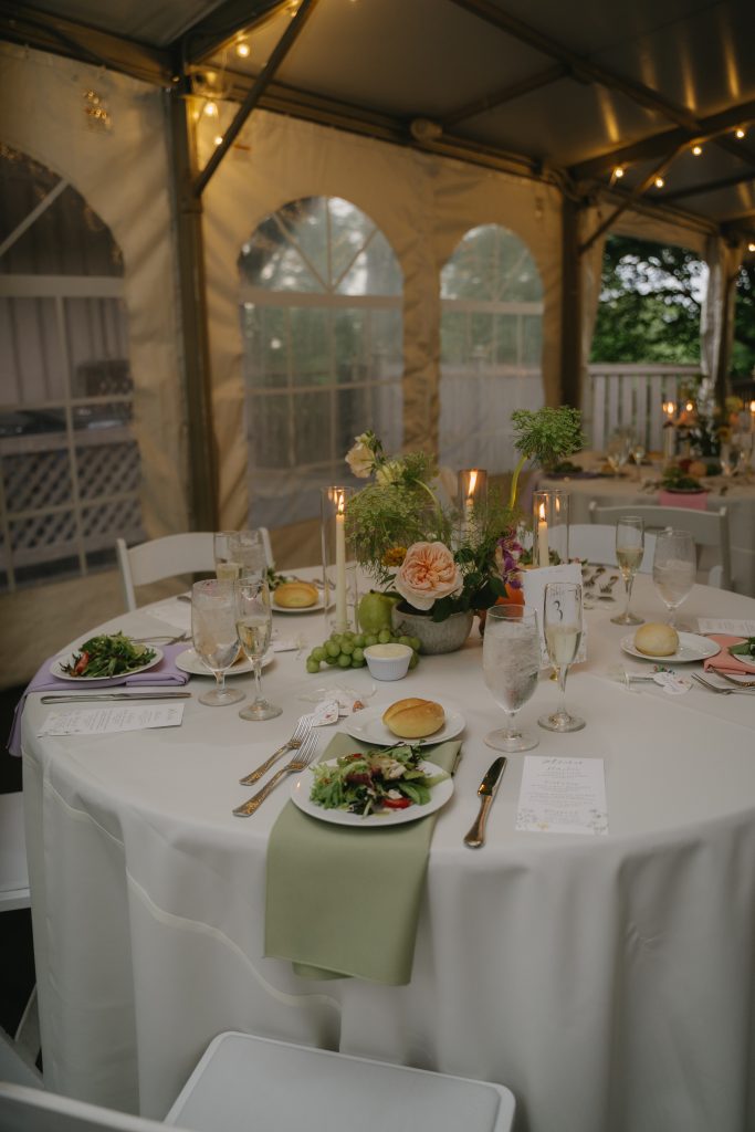 Wedding reception tables under white tent in Philadelphia suburb